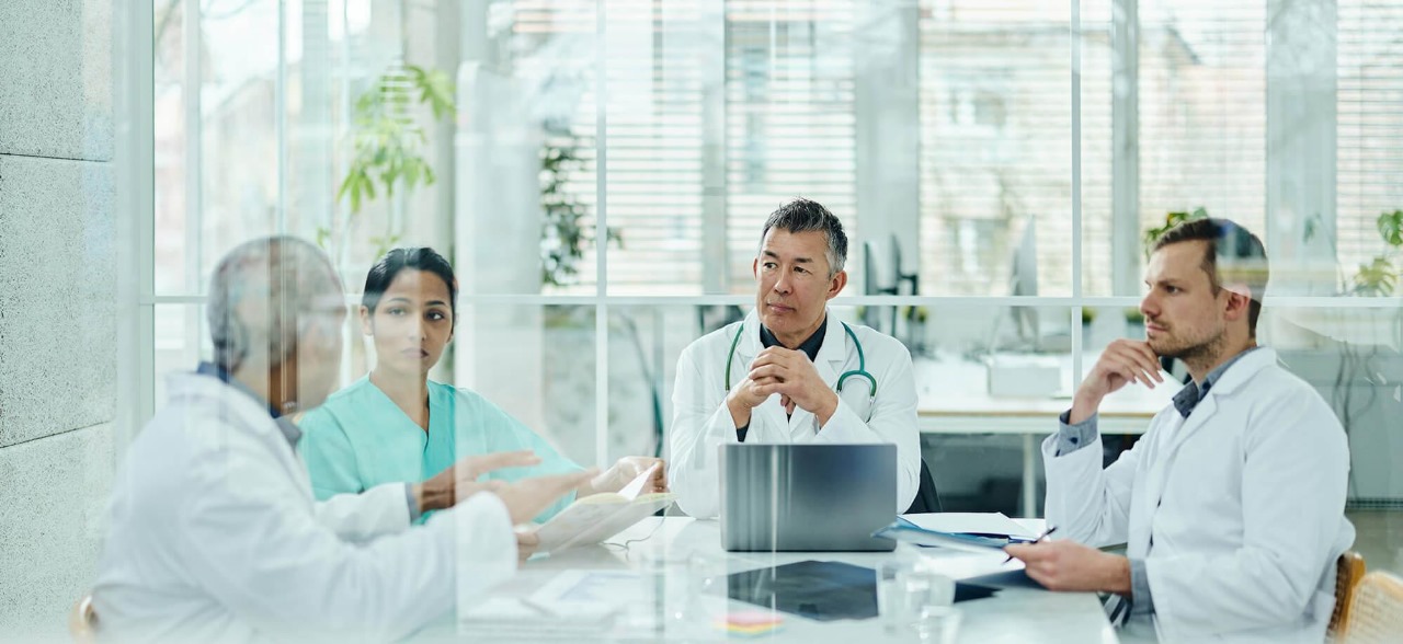 Healthcare professionals joining hands